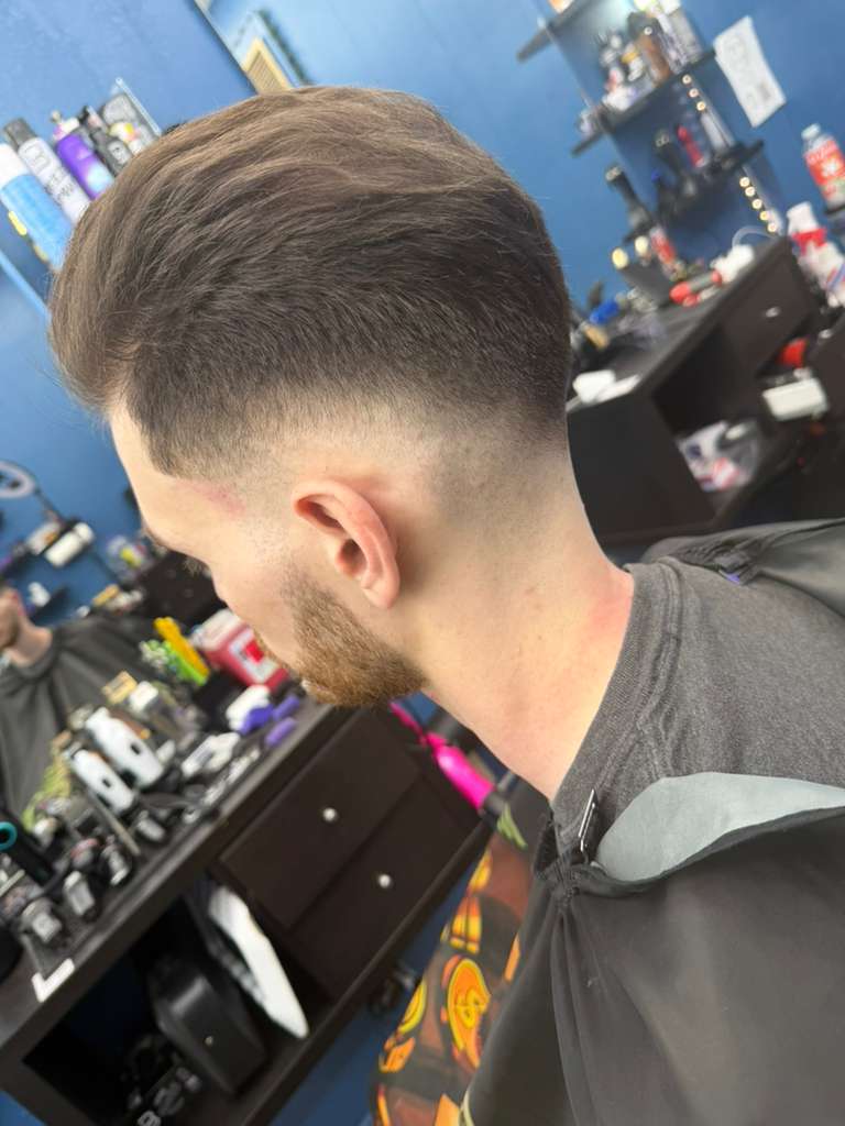 Back fade with light hair by Alex Urbaez Barber