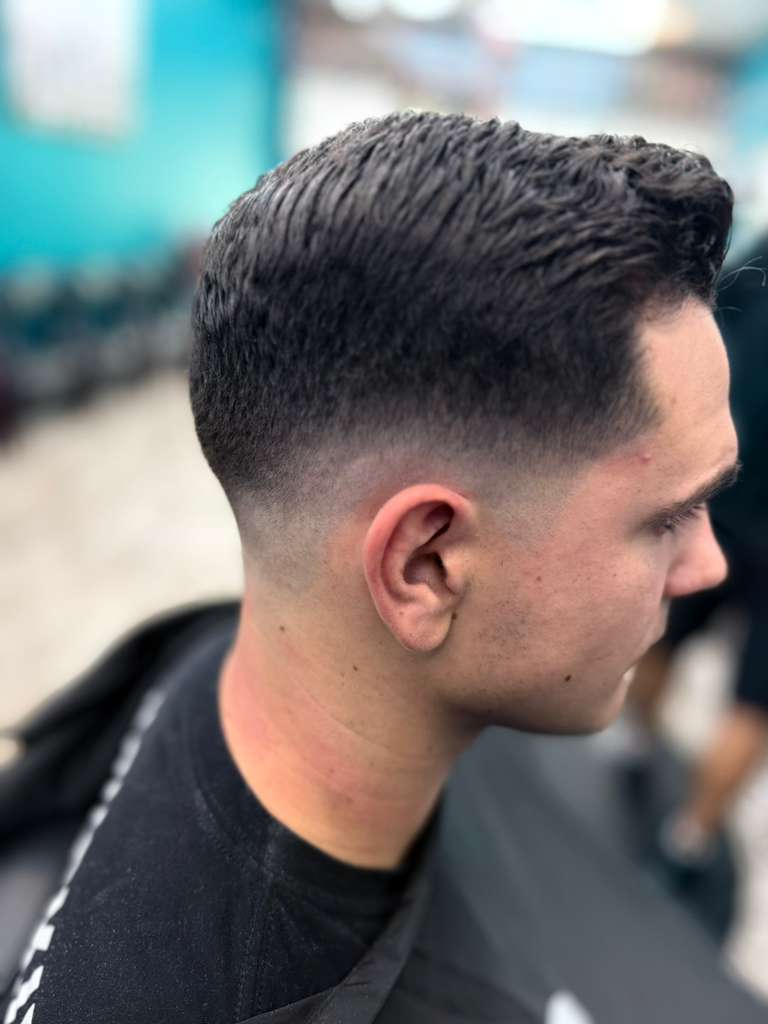 Sharp fade haircut by Alex Urbaez in Gainesville Florida